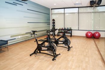 On site yoga studio with two stationary bikes and virtual fitness classes available.